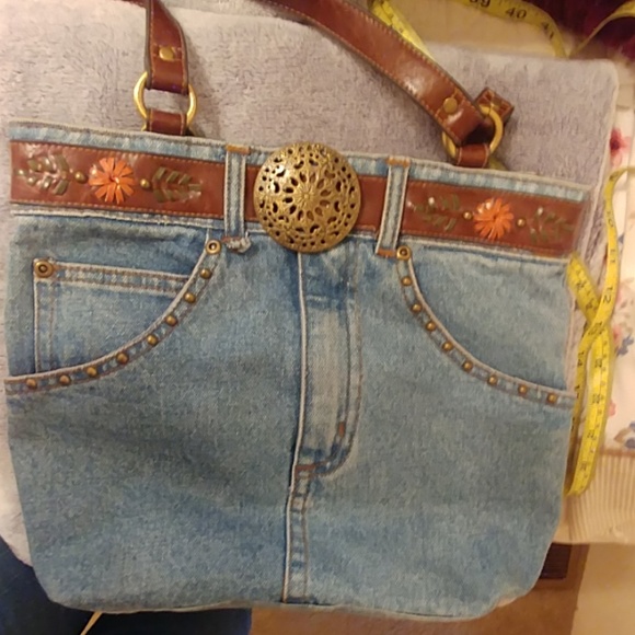 This is a jean bag with five pockets and brown han - Picture 2 of 3